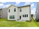 Back exterior of a vinyl-sided two-story home with well-manicured green lawn at 27 Silver Moon Ln, Clayton, NC 27527