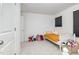 Playful bedroom with a colorful bed, toy shopping cart, and organized storage baskets for a kid-friendly space at 27 Silver Moon Ln, Clayton, NC 27527