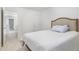Bright bedroom featuring carpet, a comfortable bed, and a door leading to additional rooms at 27 Silver Moon Ln, Clayton, NC 27527