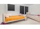 Shared bedroom featuring twin beds, plush bedding, and natural light streaming through window at 27 Silver Moon Ln, Clayton, NC 27527