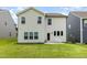Exterior of a home showing backyard with patio and well-manicured green lawn at 27 Silver Moon Ln, Clayton, NC 27527