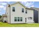 Exterior back of a two-story home with vinyl siding and a green lawn at 27 Silver Moon Ln, Clayton, NC 27527