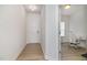 Bright entryway with hardwood floors, a white front door, and an office visible to the right at 27 Silver Moon Ln, Clayton, NC 27527