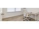 Bright office space with a large window and a comfortable white desk chair at 27 Silver Moon Ln, Clayton, NC 27527