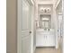 Bathroom featuring white cabinetry, updated fixtures, and neutral tile flooring for a clean and modern feel at 2716 Willow Rock Ln, Apex, NC 27523