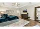 Bright bedroom showcasing a TV, dresser, a mirror, neutral walls, and plush carpet for a cozy, inviting atmosphere at 2716 Willow Rock Ln, Apex, NC 27523