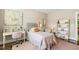 Charming bedroom features a desk, shelving, and a comfortable bed for a cozy and stylish space at 2716 Willow Rock Ln, Apex, NC 27523