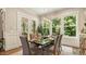 Elegant dining room featuring stylish furniture, large windows, and natural light, ideal for Gathering meals and gatherings at 2716 Willow Rock Ln, Apex, NC 27523