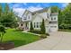 Well-maintained home featuring an attached two-car garage and a spacious driveway at 2716 Willow Rock Ln, Apex, NC 27523