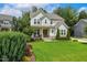 Inviting home with manicured lawn, decorative shrubs, and adjacent properties at 2716 Willow Rock Ln, Apex, NC 27523