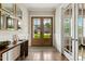 Charming foyer showcasing hardwood floors, double doors, and a bright, airy ambiance at 2716 Willow Rock Ln, Apex, NC 27523