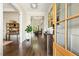 Elegant entryway featuring hardwood floors, stylish console table, and an open floor plan at 2716 Willow Rock Ln, Apex, NC 27523