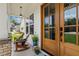 Charming front porch with wooden rocking chairs and a view of the well-manicured yard and landscaping at 2716 Willow Rock Ln, Apex, NC 27523
