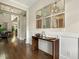 Stylish hallway with hardwood floors, modern decor, and seamless flow to living spaces at 2716 Willow Rock Ln, Apex, NC 27523