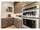 Well-equipped kitchen with stainless steel appliances, custom cabinets, and sleek countertops for a modern aesthetic at 2716 Willow Rock Ln, Apex, NC 27523