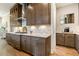 Modern kitchen features marble countertops, stainless steel appliances, and custom cabinets with designer hardware at 2716 Willow Rock Ln, Apex, NC 27523