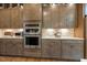 Gourmet kitchen with stainless steel appliances, custom cabinets, and recessed lighting, perfect for cooking enthusiasts at 2716 Willow Rock Ln, Apex, NC 27523