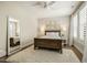 Tranquil main bedroom with a plush rug, white bedding, and natural light to create a relaxing retreat at 2716 Willow Rock Ln, Apex, NC 27523