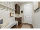 Charming mudroom with white wainscoting, built-in bench, and custom storage, blending style and functionality at 2716 Willow Rock Ln, Apex, NC 27523