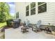 Outdoor patio featuring comfortable seating, a grill, and a fire pit, perfect for entertaining at 2716 Willow Rock Ln, Apex, NC 27523