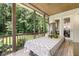 Inviting screened-in porch with a dining table, offering a comfortable outdoor dining and relaxation area at 2716 Willow Rock Ln, Apex, NC 27523