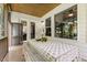 Inviting screened-in porch with a dining table for outdoor entertaining and relaxing at 2716 Willow Rock Ln, Apex, NC 27523