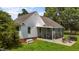Spacious backyard with a screened-in porch and well-maintained lawn at 2856 Gwyn Rd, Elon, NC 27244