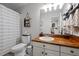 Bathroom features a shower, toilet, sink, and vanity at 2856 Gwyn Rd, Elon, NC 27244