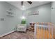 Cozy Bedroom with crib, area rug, chair, and decor at 2856 Gwyn Rd, Elon, NC 27244