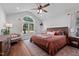 Vaulted ceiling bedroom with large window and comfortable furnishings at 2856 Gwyn Rd, Elon, NC 27244