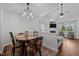 Cozy dining area next to living room with chandelier and nice decor at 2856 Gwyn Rd, Elon, NC 27244