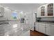 Bright kitchen with white cabinets, granite countertops, and stainless steel appliances at 2856 Gwyn Rd, Elon, NC 27244