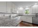 Bright kitchen featuring white cabinets, granite countertops, and stainless appliances at 2856 Gwyn Rd, Elon, NC 27244