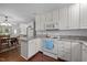 Bright kitchen with white cabinets, granite countertops, and stainless steel appliances at 2856 Gwyn Rd, Elon, NC 27244