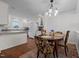 Dining area with connection to kitchen featuring white cabinets and granite countertops at 2856 Gwyn Rd, Elon, NC 27244