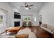 Comfortable living room with a fireplace, hardwood floors, and ample seating under a vaulted ceiling at 2856 Gwyn Rd, Elon, NC 27244