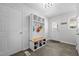 Mudroom featuring a built-in bench, shelving, and hooks at 2856 Gwyn Rd, Elon, NC 27244