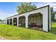Multiple bay white metal outbuilding with equipment stored inside and a green lawn in the foreground at 2856 Gwyn Rd, Elon, NC 27244