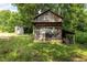 Charming wooden shed surrounded by lush greenery, providing a rustic and functional outdoor space at 2856 Gwyn Rd, Elon, NC 27244