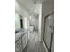 Large bathroom with dual vanities, granite countertops, walk-in shower, and neutral tile at 290 Busterfield Ct, Benson, NC 27504