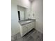 Bathroom vanity featuring granite countertops, white cabinetry, and tile floors at 290 Busterfield Ct, Benson, NC 27504