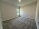 Bright bedroom with carpet, one window, base molding, and neutral walls at 290 Busterfield Ct, Benson, NC 27504
