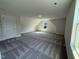 Spacious bonus room with carpet and window at 290 Busterfield Ct, Benson, NC 27504