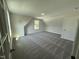 Spacious bonus room with carpet and window at 290 Busterfield Ct, Benson, NC 27504