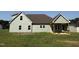 Two-story house featuring light-colored vinyl siding, a brown roof, and a covered porch area at 290 Busterfield Ct, Benson, NC 27504