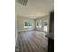 Eat-in kitchen features wood-look floors and lots of natural light from the multiple windows at 290 Busterfield Ct, Benson, NC 27504