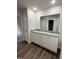 Bathroom featuring double sink vanity with granite countertop at 295 Eason Creek Way, Clayton, NC 27527
