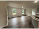 Bright dining area featuring luxury vinyl floors and large windows at 295 Eason Creek Way, Clayton, NC 27527