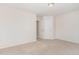 Clean bedroom with plush carpeting and white trim, with a door leading to a closet at 3036 Landing Falls Ln, Raleigh, NC 27616