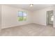 Bedroom featuring neutral walls and carpet with a bright window view at 3036 Landing Falls Ln, Raleigh, NC 27616